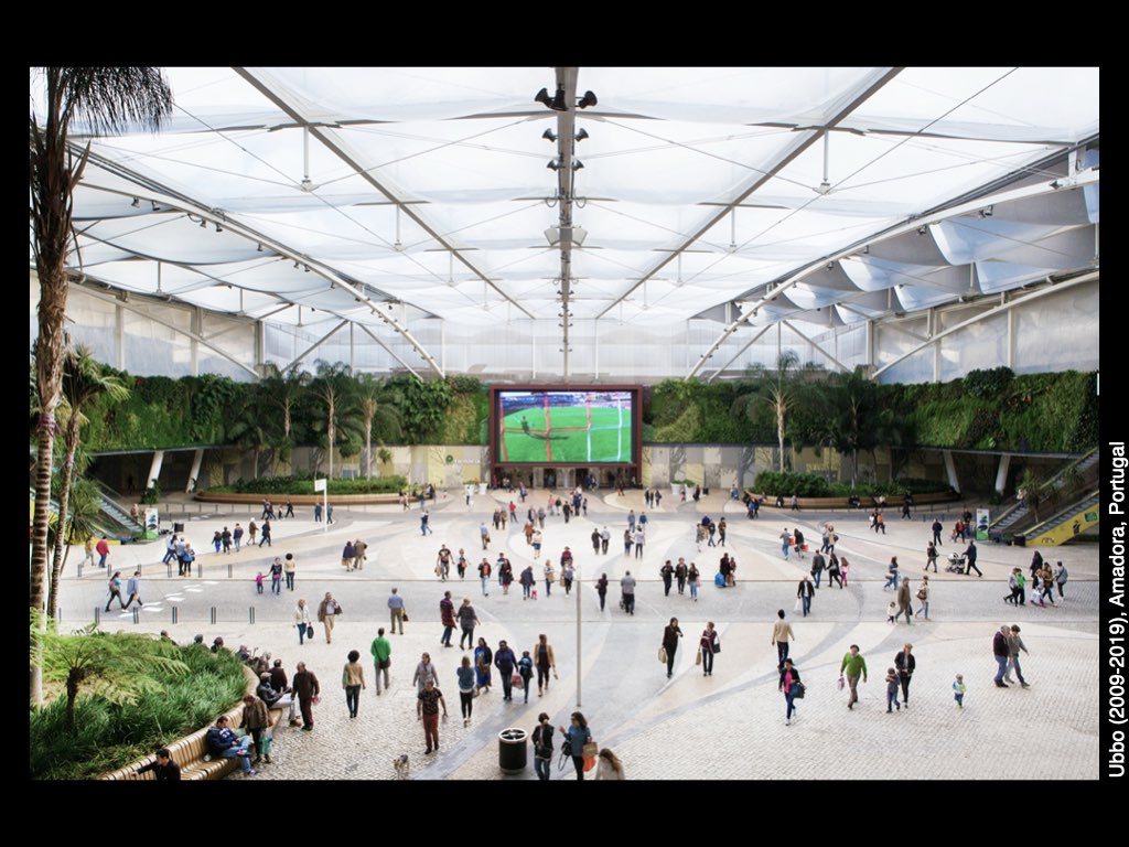 A picture containing text, building, rink, people
Description automatically generated